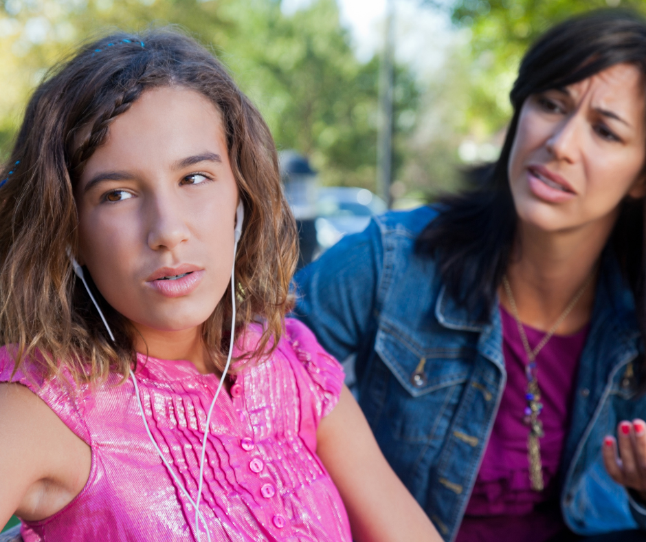 frustrate mother and her didmissive teenage daughter in a tense moment to show lack of co-regulation and emotional regulation in teens