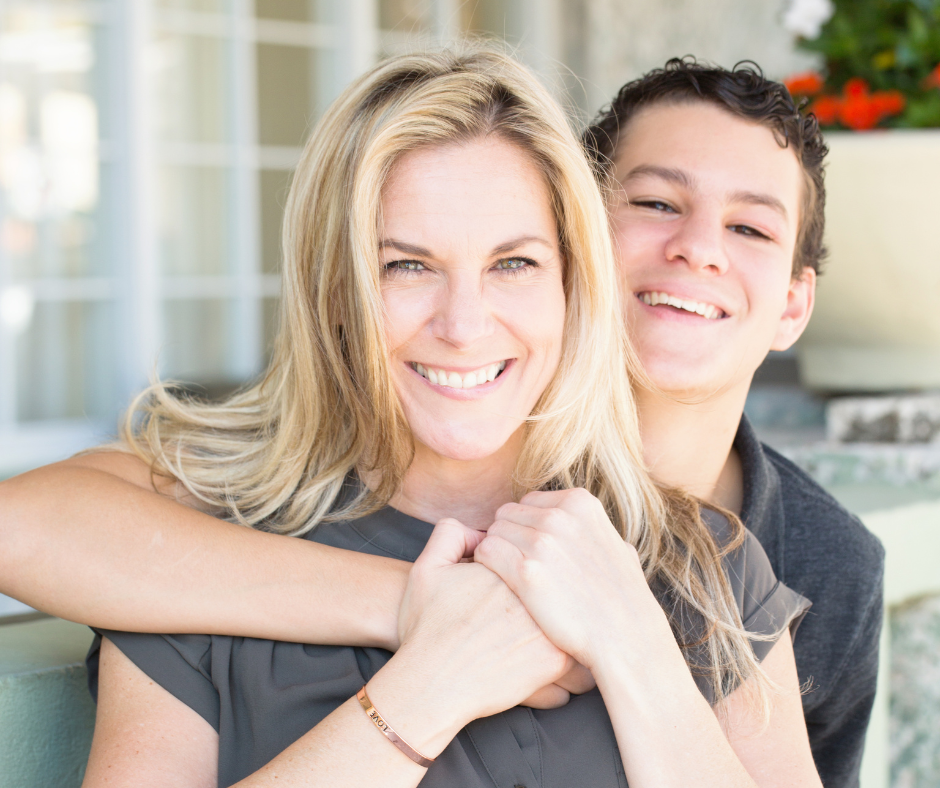 happy mother and her teenage son co-regulating big feelings