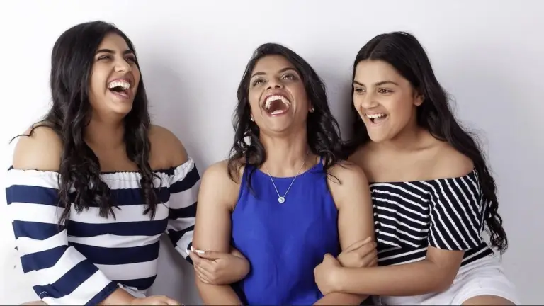 Yolanda Alvares joyfully laughing with her two teenage daughters, symbolising deep family connection, emotional resilience, and the heart behind her 12-Week Emotional Mastery Program for parents.