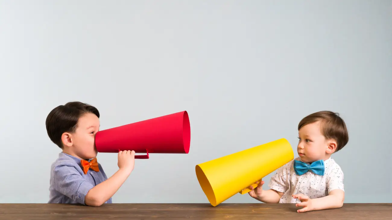 2 toddler boys with megaphones