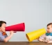 2 toddler boys with megaphones