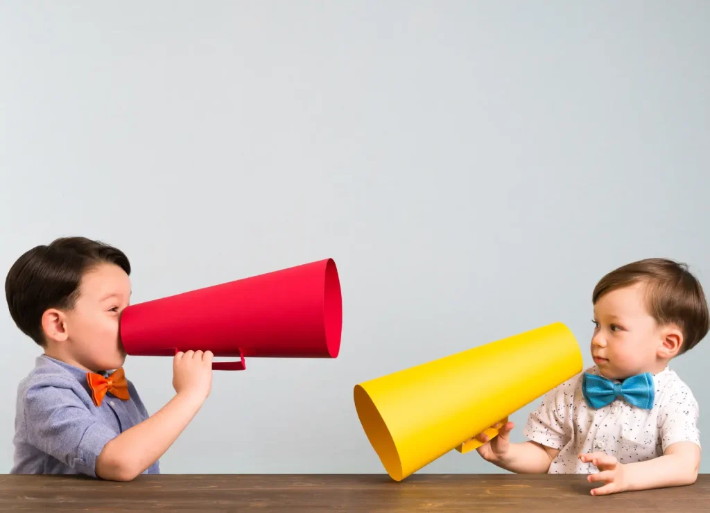 2 toddler boys with megaphones